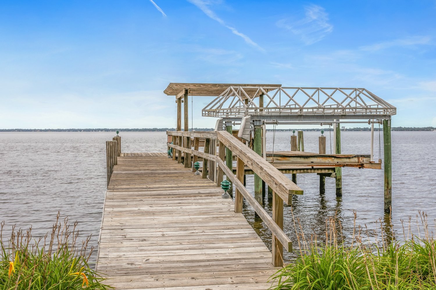 The dock on the St. Johns River is directly behind the house.